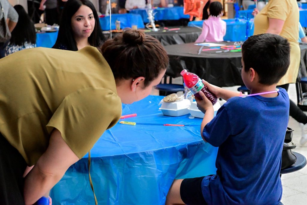 Hannah Penn PreK-8 students, families, and staff gathered in Hannah Penn PreK-8's school cafeteria for a Family Engagement event titled Harmony Night.