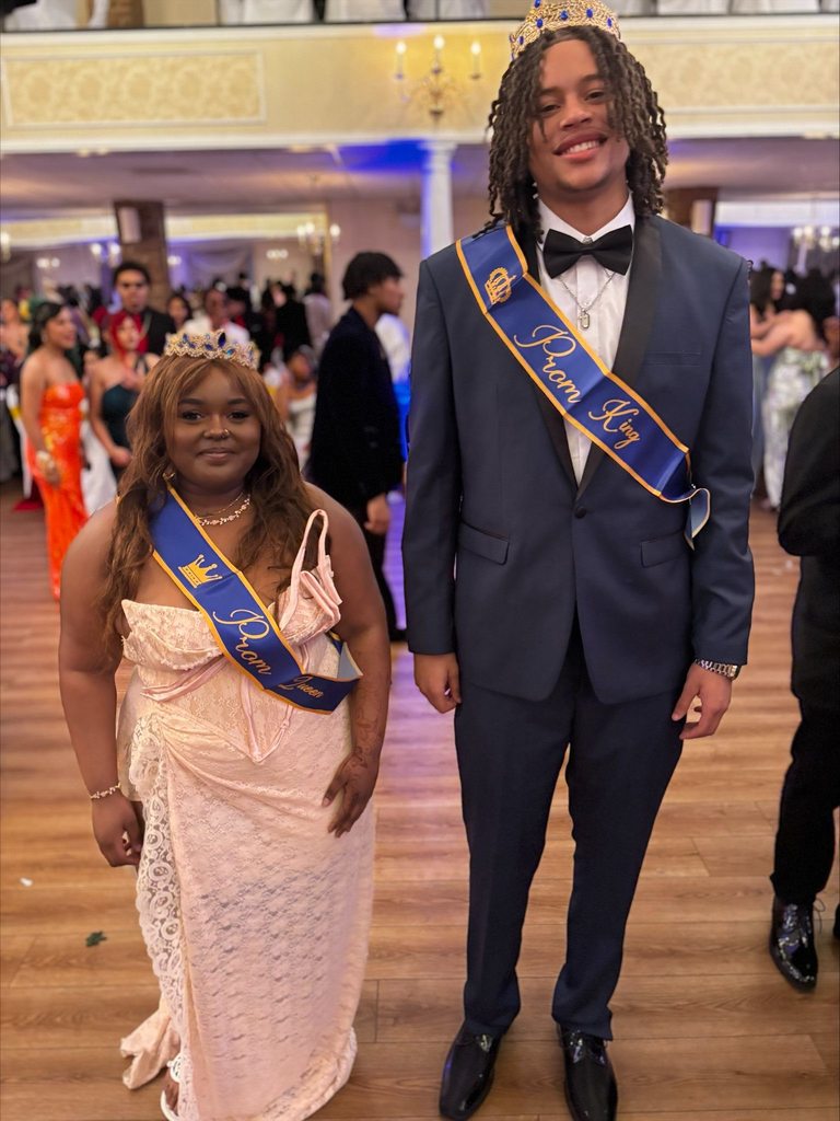 This year's William Penn Senior High School's Prom Queen, Ericka Goodman and Prom King, Brandon DeShields are wearing Prom Queen and King sashes while posing together for a photo.
