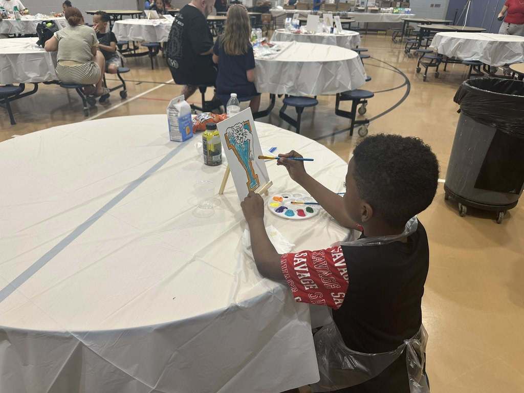 Ferguson PreK-8 families and staff recently gathered to participate in Paint Night in the Ferguson Cafeteria.