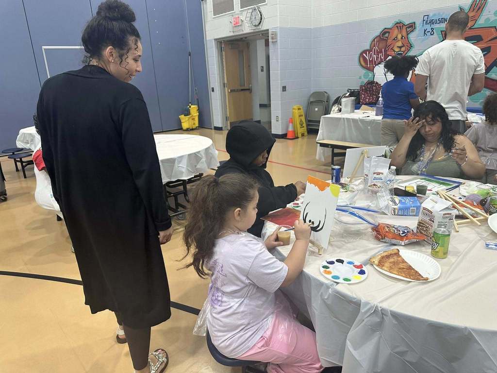Ferguson PreK-8 families and staff recently gathered to participate in Paint Night in the Ferguson Cafeteria.