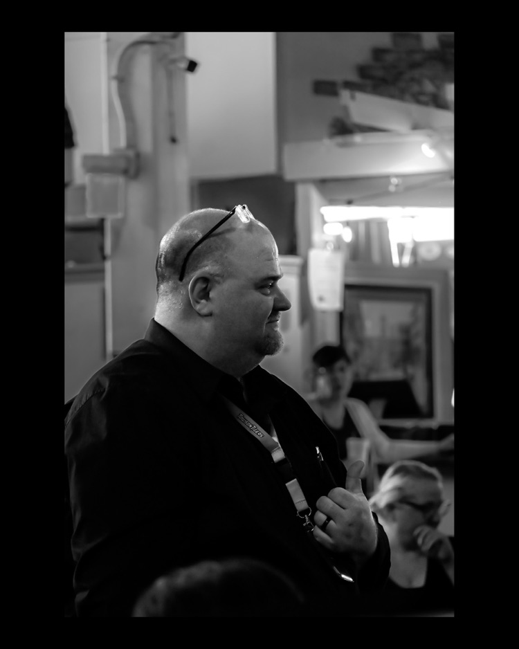 WPSHS performing in central market, director with his thumbs up 
