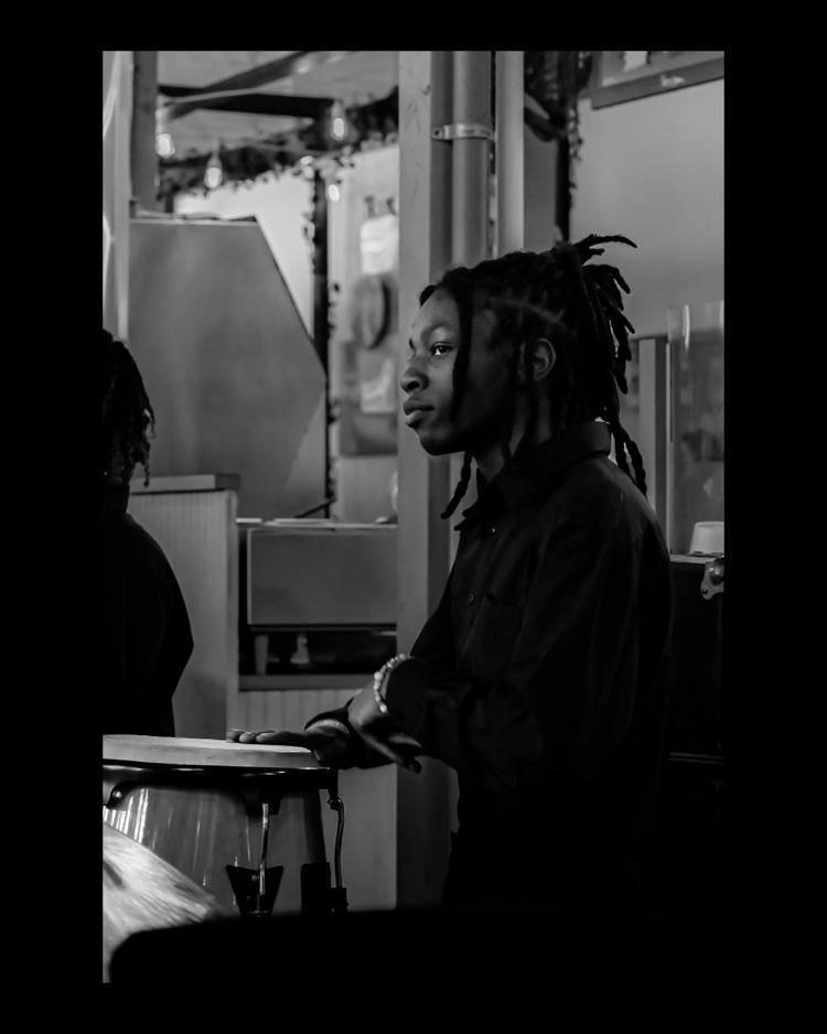 WPSHS performing in central market, drummer with his hand on the drum