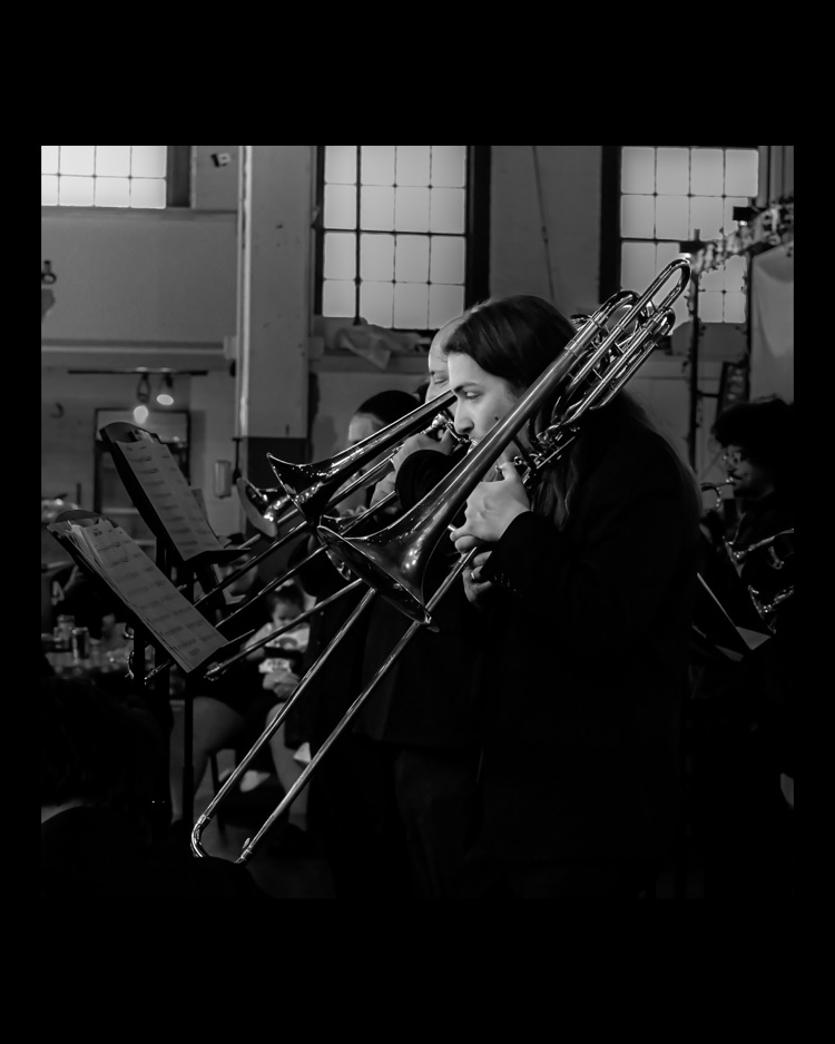 WPSHS performing in central market, student playing the trombone 