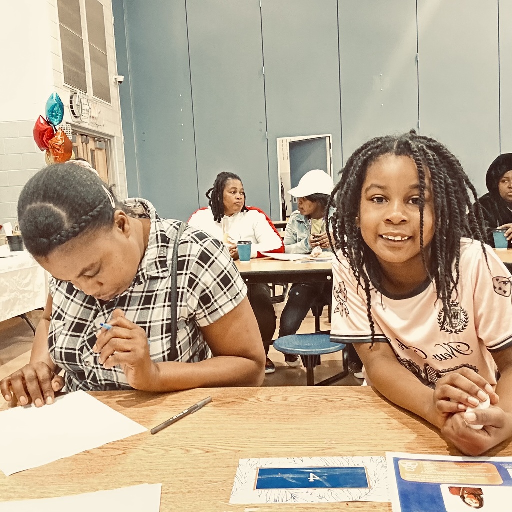 Ferguson families recently attended a literacy meeting in a school cafeteria.