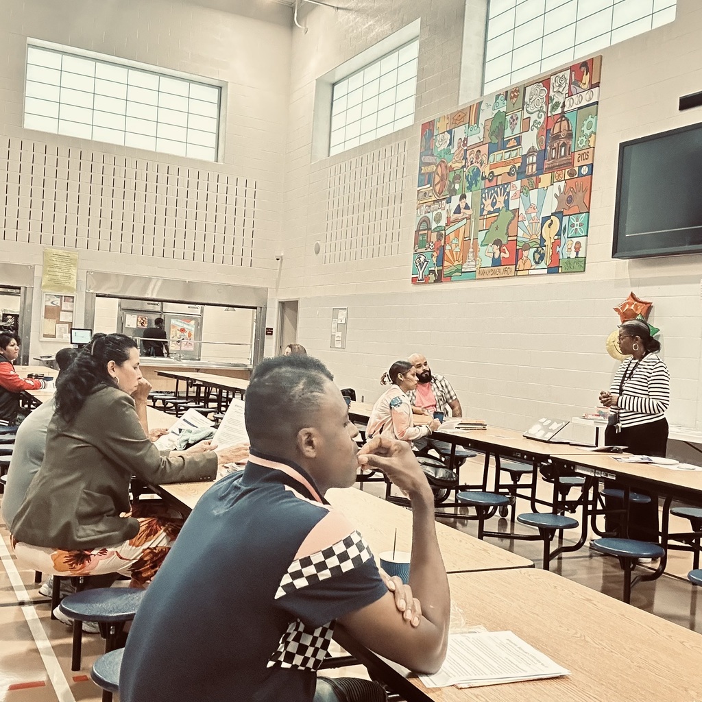 Ferguson families recently attended a literacy meeting in a school cafeteria.