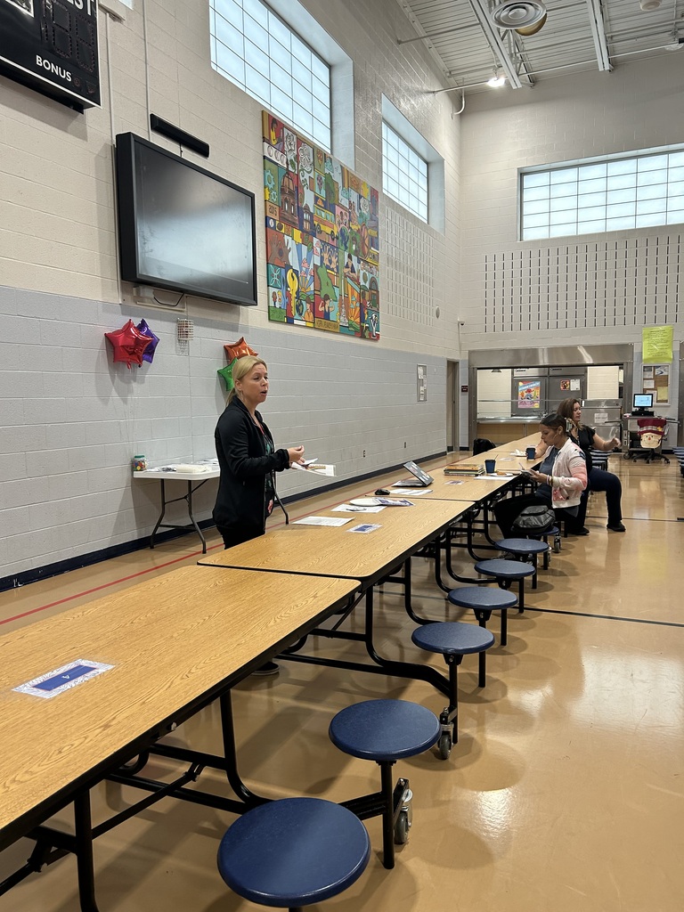 Ferguson families recently attended a literacy meeting in a school cafeteria.