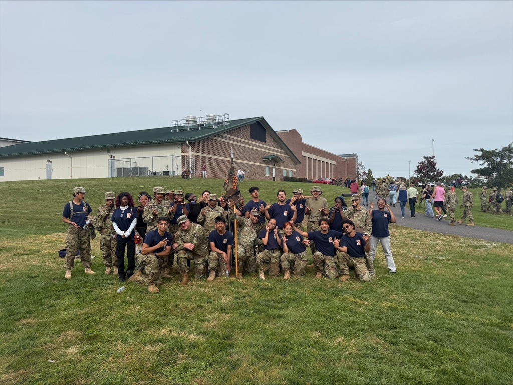 William Penn JROTC cadets are gathering for a group photo outdoors during the Raider Challenge competition.