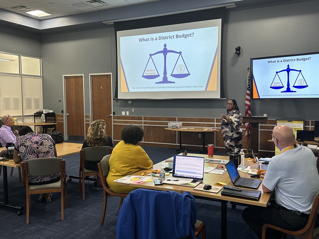 People in a board room during a Budget Listen and Learn Presentation