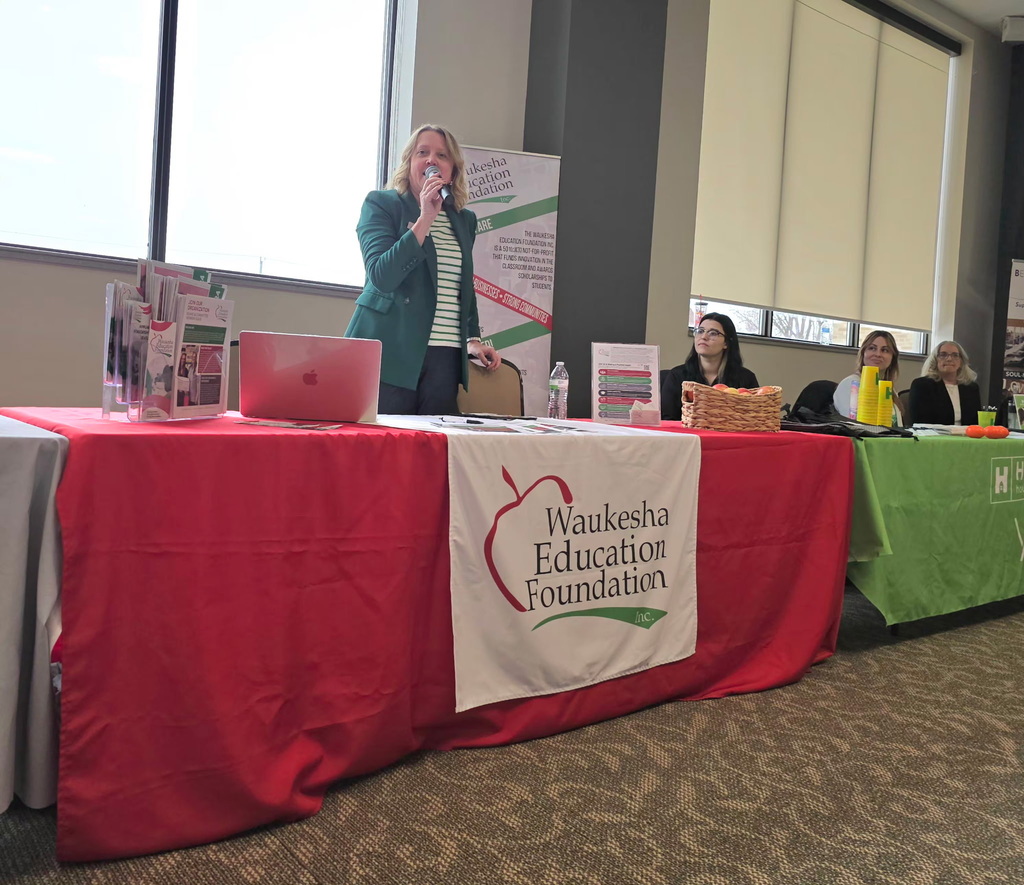 Lynnette speaking to event go-ers about the WEF