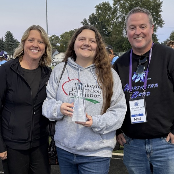 Lynnette Kalmadge (WEF Executive Director), Janaka Subotnik (Board President) and Matt Engelien (Board Director) accept the 2026 Community Service Award