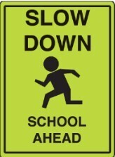 slow down  school ahead sign