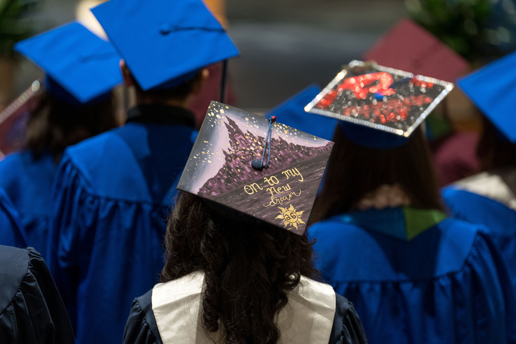 A graduation cap decorated with the words on to my own dream