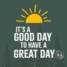 It's a good day to have a great day (Sun rising behind a backdrop of trees)