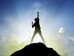 (silhouette of person atop a hill with a fist raised in victory)