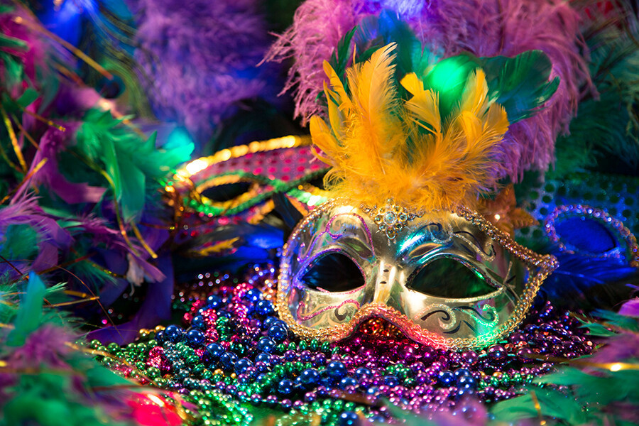 (image of mask and beads for Mardi Gras)