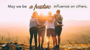 May we be a positive influence on others (photo of a group of people, arm in arm, facing a sunset)