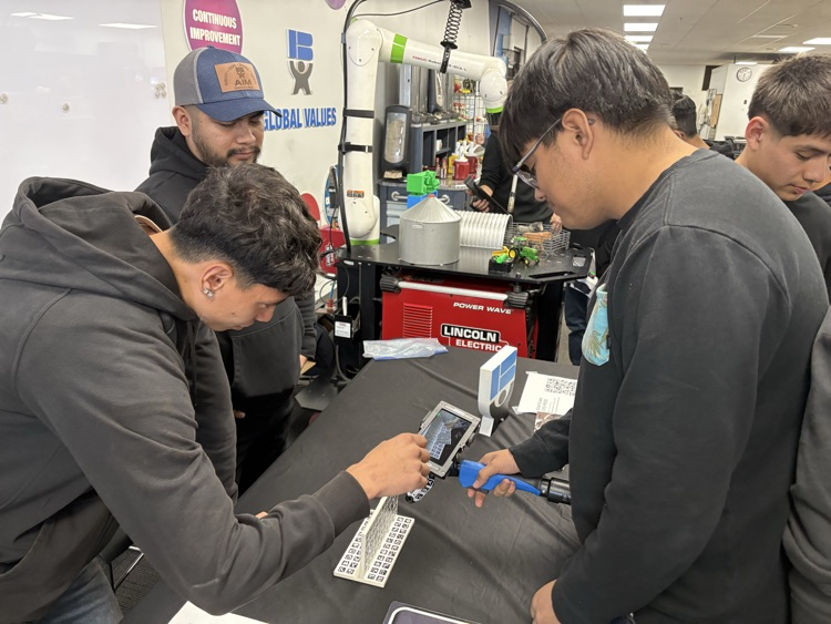 Students using a virtual welder at Behlens.
