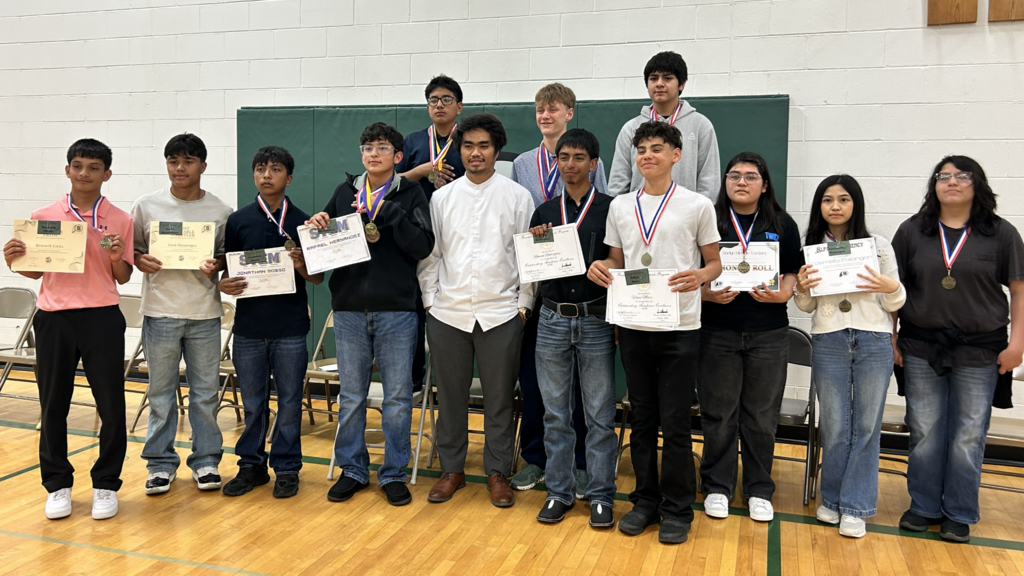 Mr. Cribello and his Olympiad Team with their medals.