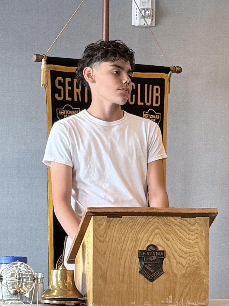 Felipe reading his essay at the Sertoma Luncheon.  