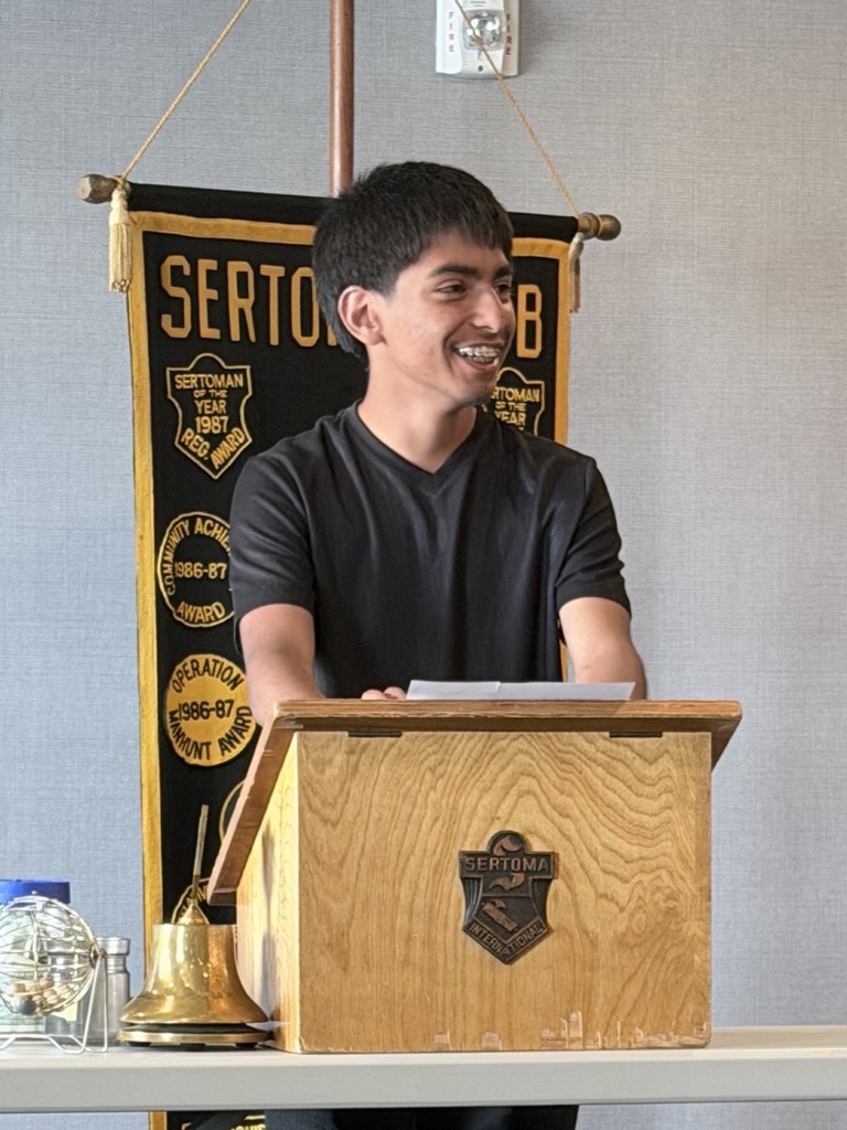 Roman reading his essay at the Sertoma Luncheon.  