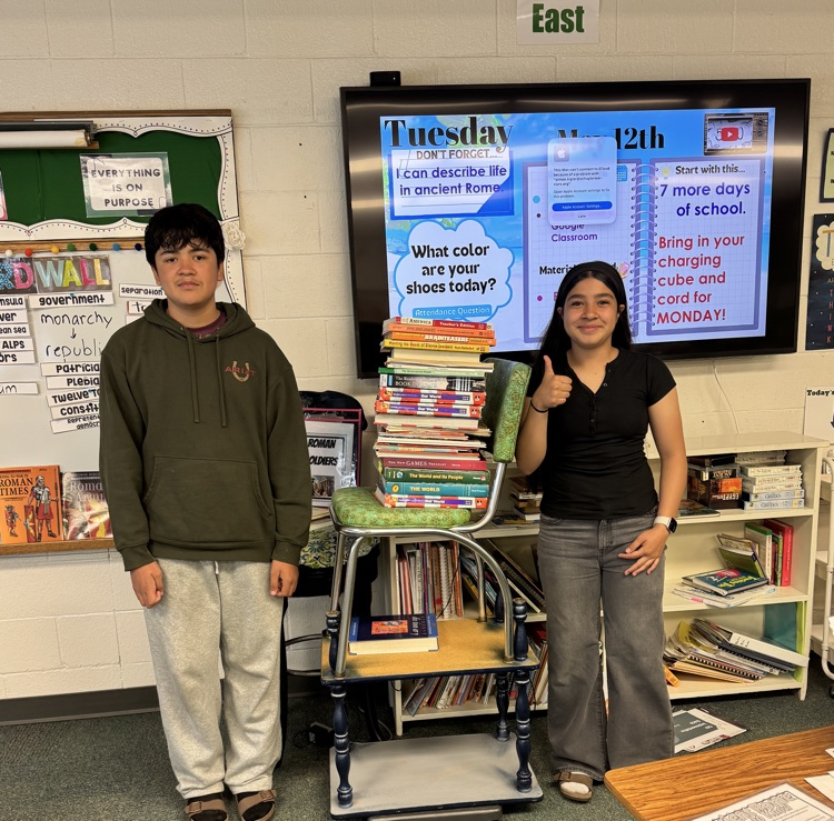 6th graders weighing books to 90 pounds to represent a Roman soldier's back pack. 