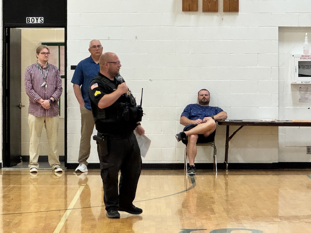 Officer Terrell leading an assemly about Online Safety.