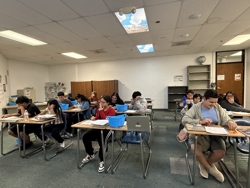 students using paper atom models to build simple molecules