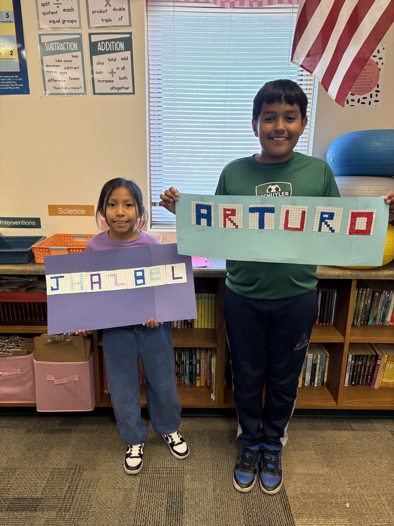 Miss Keller's  4th graders are learning how to change fractions to decimals! 🔢 Students were able to find the fraction of their shaded letters and then convert it into a decimal. They wanted to show off their hard work! 🎉