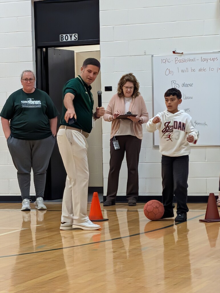 Mr. Mlinar showing student the obstacle course.