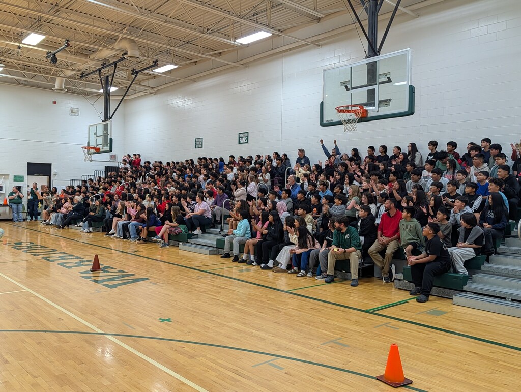 Students cheering on the obstacle course participants.