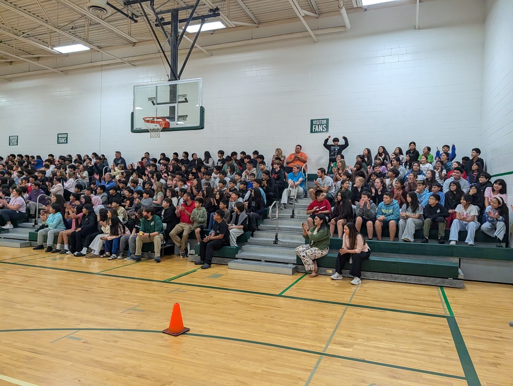 Students cheering on the obstacle course participants.
