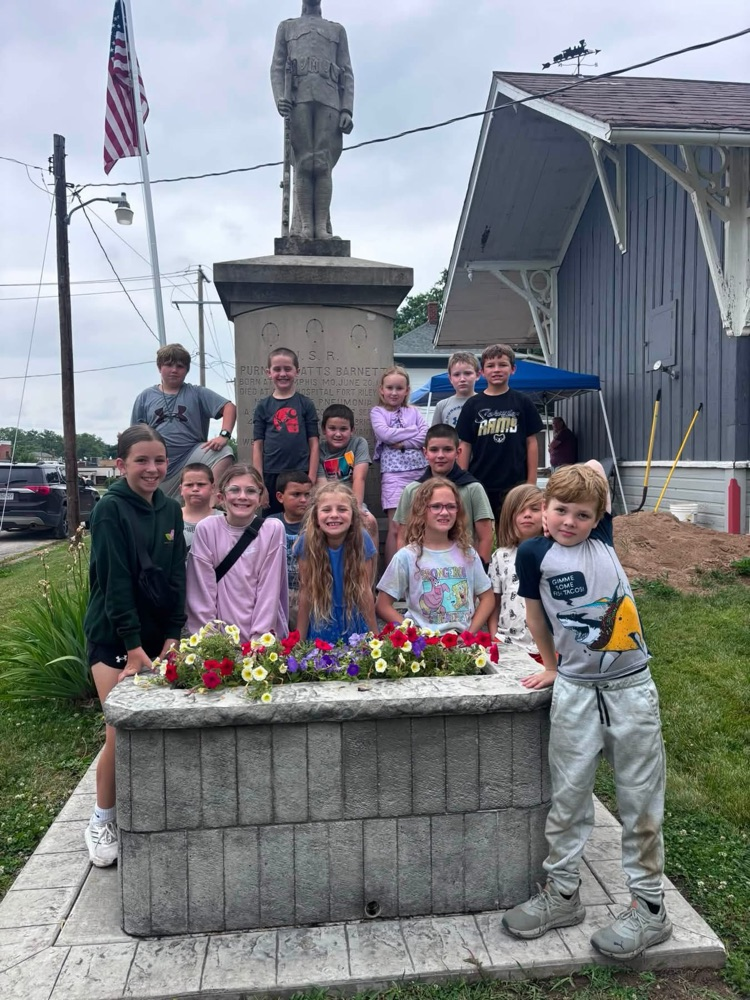 monument behind Downing House