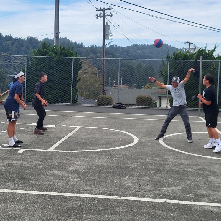 Mr. B and kids playing basketball