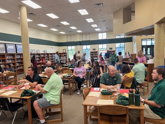 teachers in library at high school