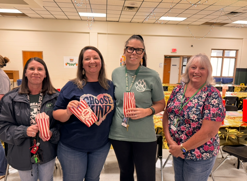teachers posing with popcorn