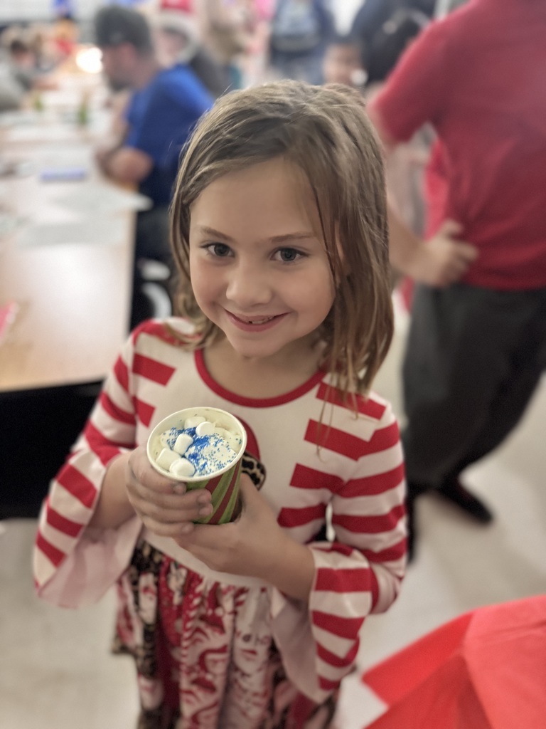 young girl drinking hot cocoa