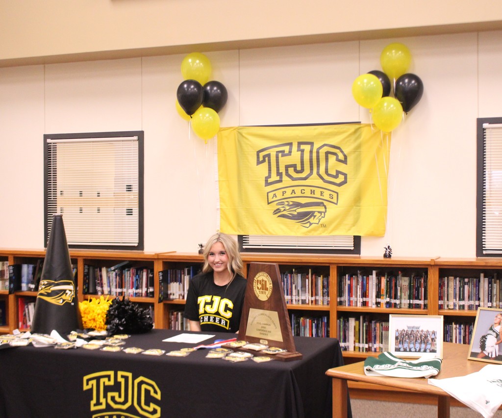 teenage blond girl in a black shirt