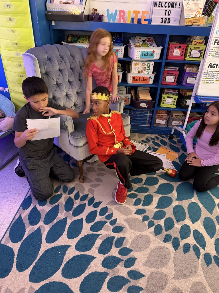 four students working together to answer a question