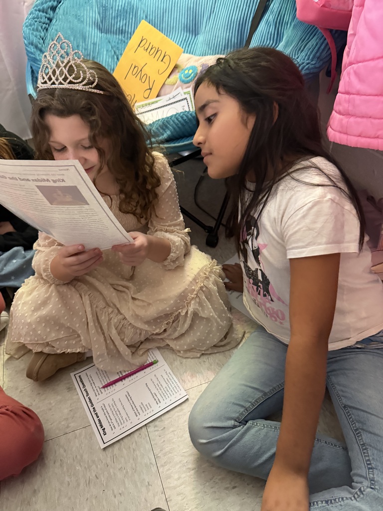 two female students trying to answer question