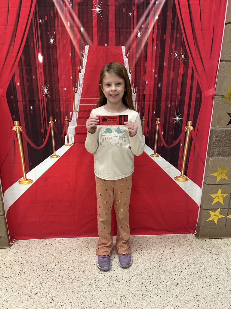 Smiling child standing in front of stairway backdrop