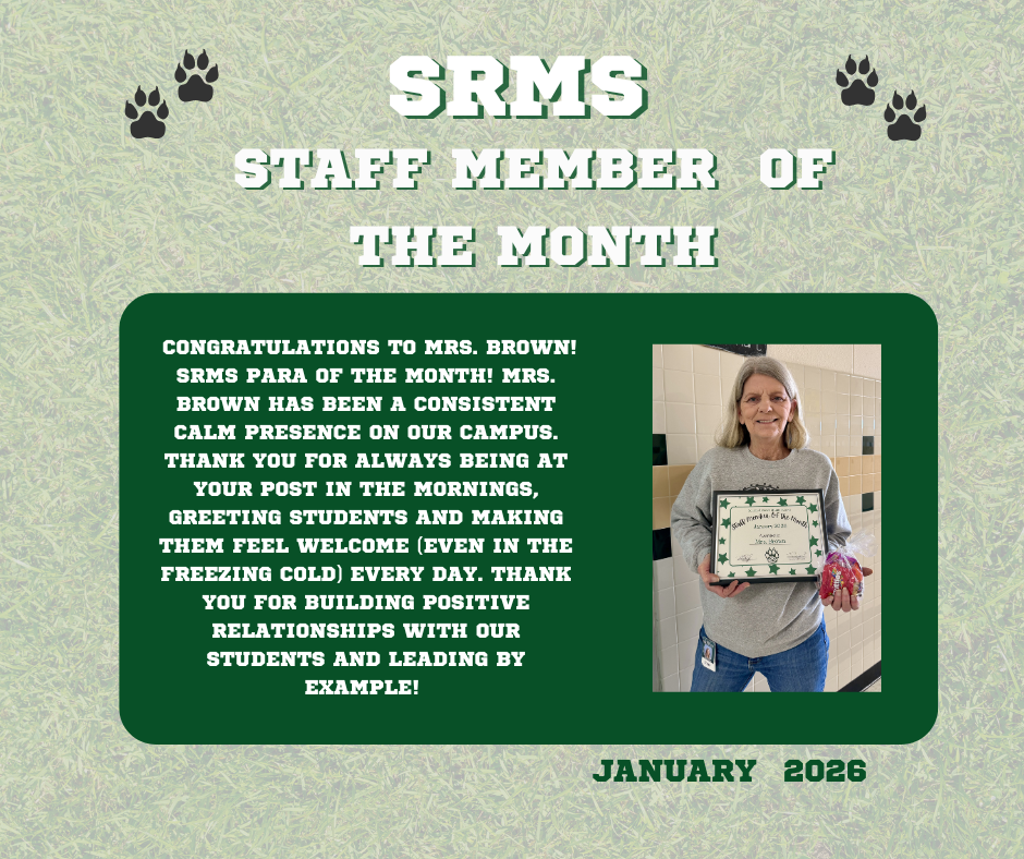 Female employee with shoulder lenght gray hair and grey sweatshirt