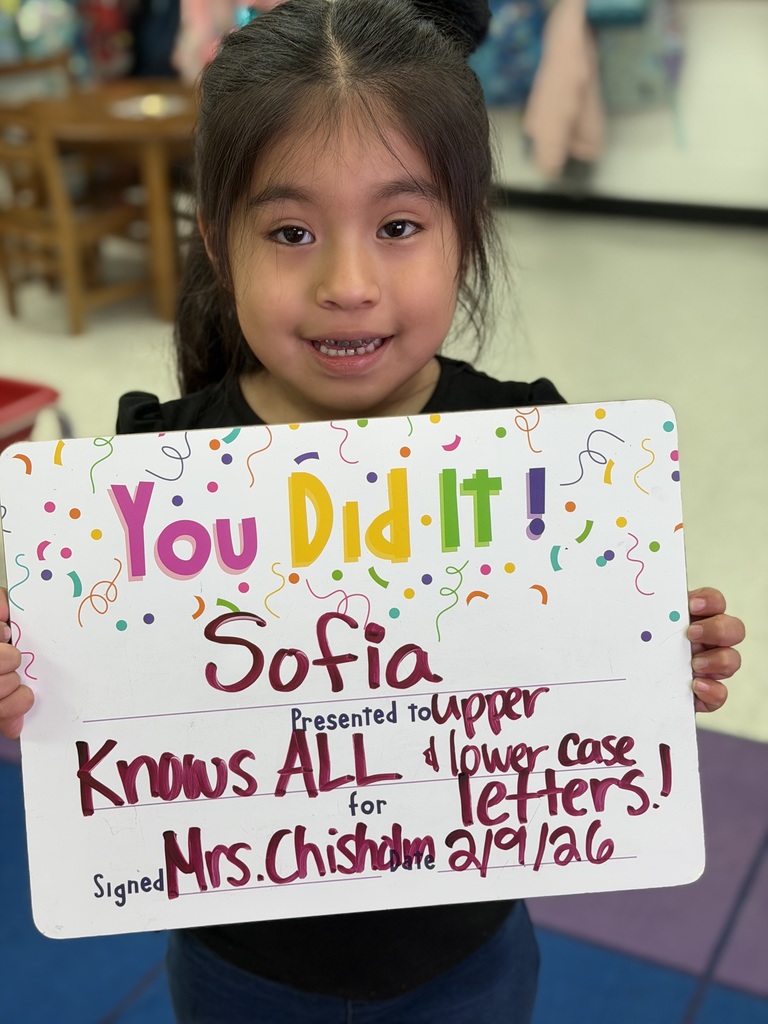 child holding celebration board