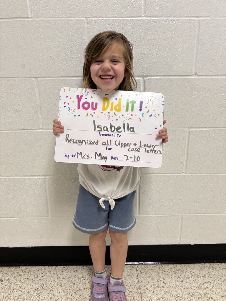 child holding celebration board