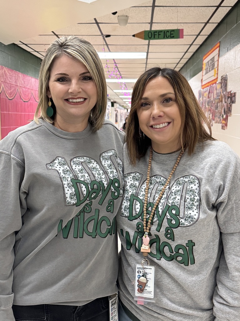 two adults white females wearing a 100 day shirt