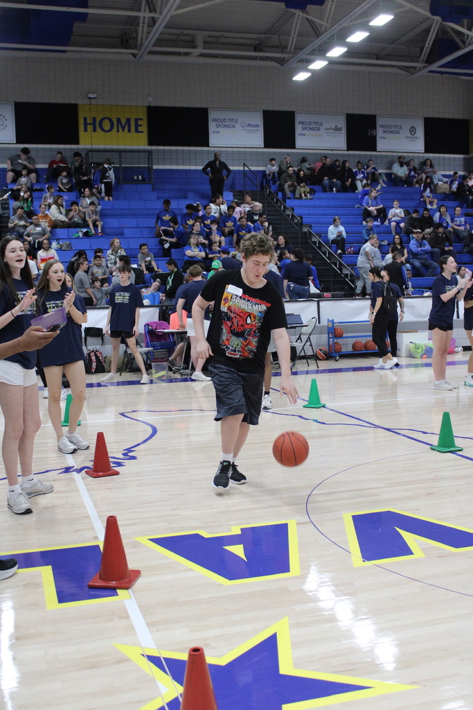 Student bouncing the basketball