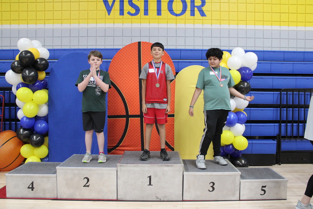 Three students with their medals
