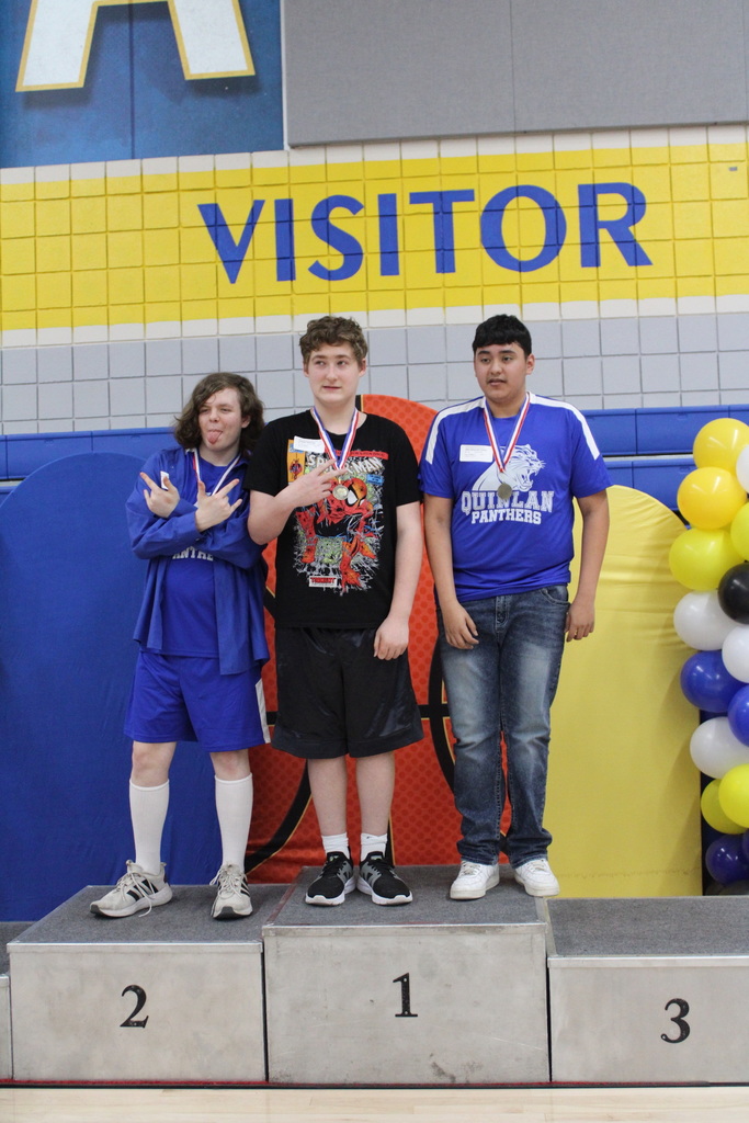 Students posting with their medals