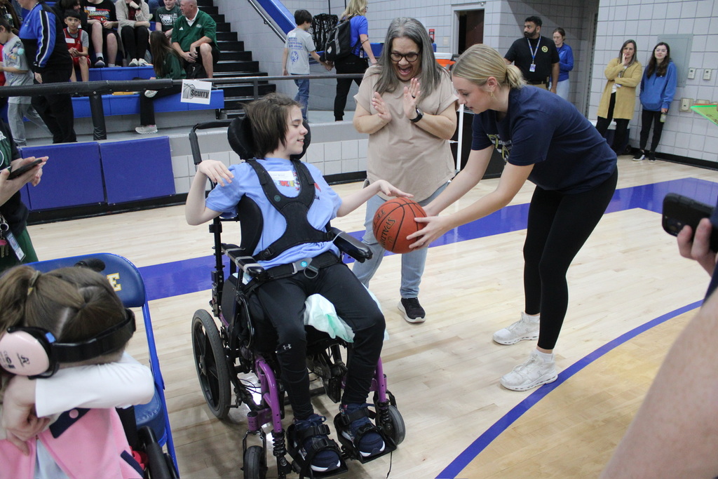 Student bouncing the basketball