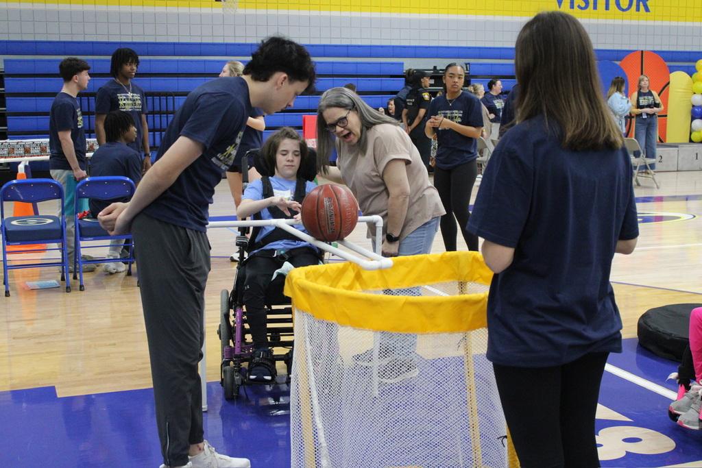 Student and teacher watching the ball