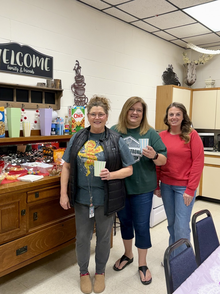 Three staff memebers taking a picture